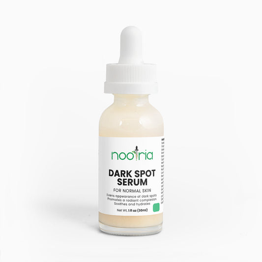 Bottle of Nootria dark spot serum on a white background